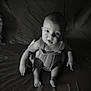 baby, infant, black_and_white, portrait, sitting, expression, face, eyes, arms, legs, skin, light, shadow, texture, clothing, indoor, cute, child, person, young