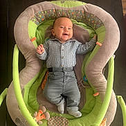 Marcel a rejoint le concours — aidez-le/la à gagner de superbes lots ! baby, infant, smile, clothing, shirt, pants, sock, baby_seat, cushion, plush, toy, happy, person, indoor, fabric, pattern, child, cute, comfortable, seat