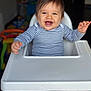 Livio participe au concours pour gagner de l'argent avec cette photo : baby, blue_eyes, child, cute, face, foot, furniture, hands, happy, high_chair, home, indoor, infant, joy, pajamas, person, playful, portrait, smiling, striped_clothing