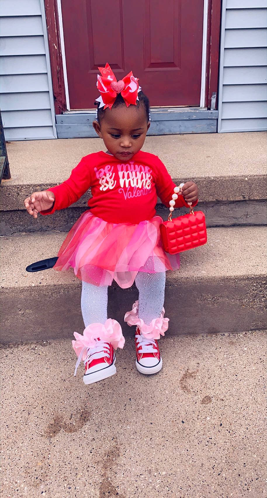 Jermahni is registered to the contest to win money with this photo: baby_toddler_clothing, cap, eye, face, footwear, hair, happy, hat, head, human_body, magenta, person, pink, red, shoe, sleeve, smile, sneakers, sock, street_fashion