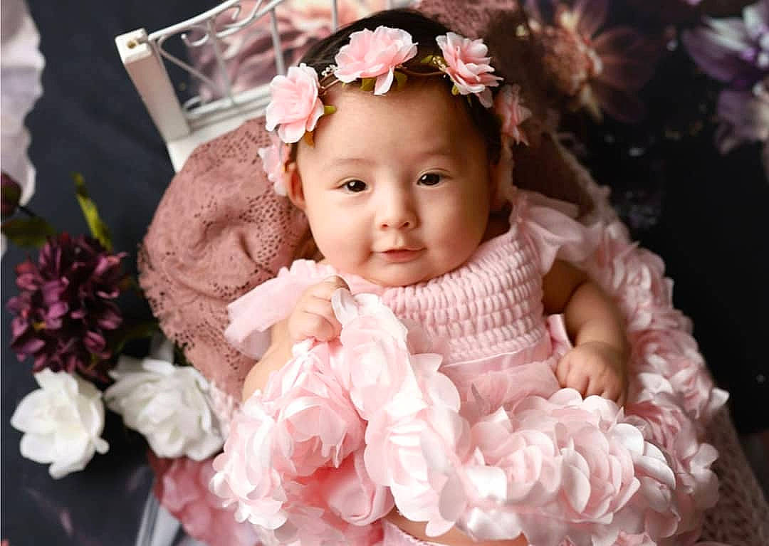 Giavanna joined the competition — help win amazing prizes! baby, baby_toddler_clothing, bouquet, bridal_accessory, child, dress, embellishment, flash_photography, flower, flower_arranging, happy, headgear, headpiece, headwear, iris, person, petal, pink, plant, textile