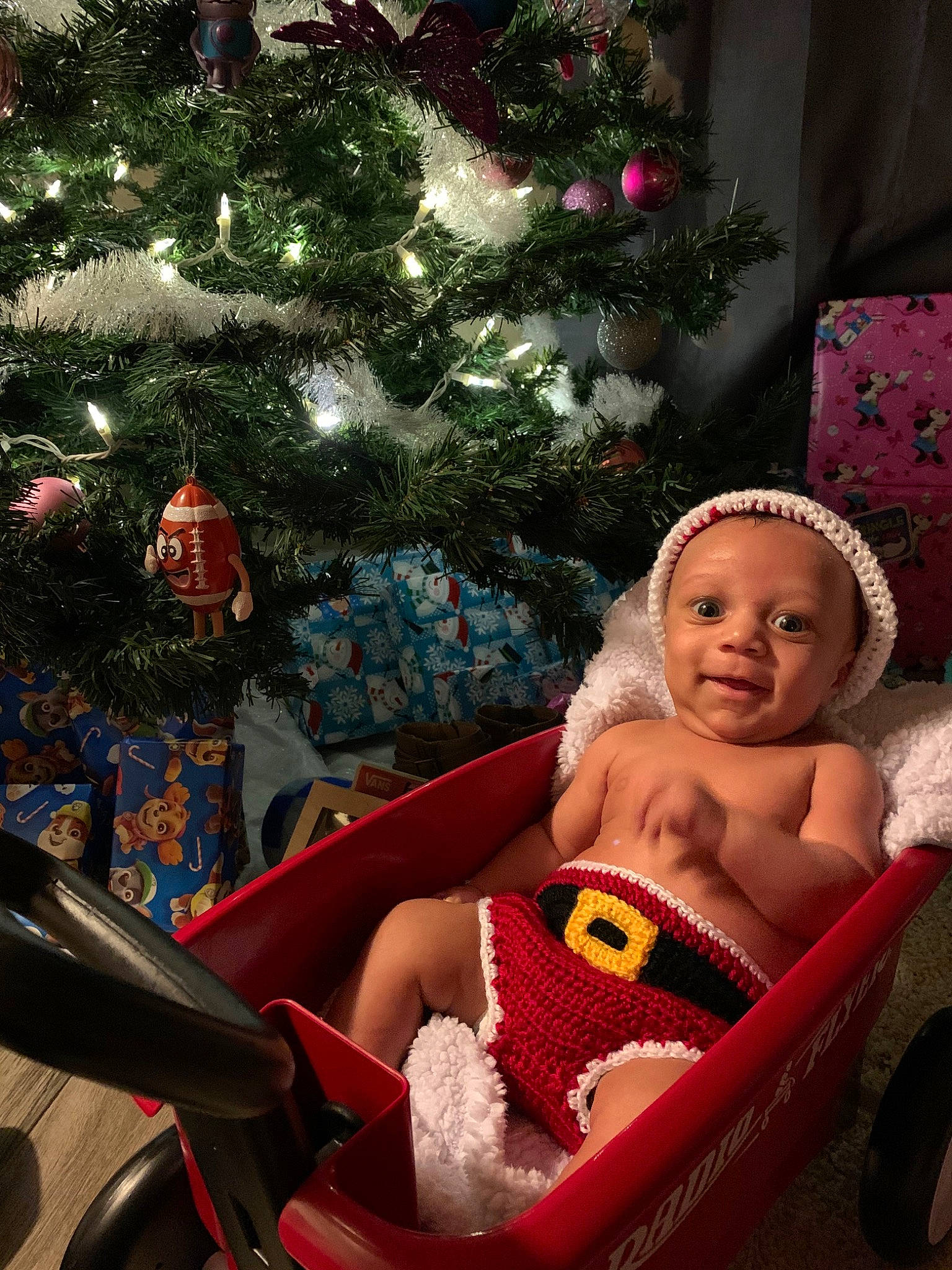 Joseph joined the competition — help win amazing prizes! baby, child, christmas, christmas_decoration, christmas_eve, christmas_lights, christmas_ornament, christmas_tree, event, fictional_character, holiday, interior_design, lap, person, plant, sitting, toddler, tree