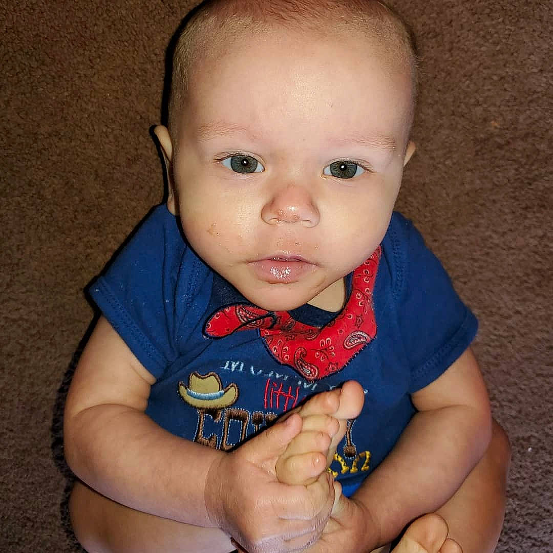 Clinton is registered to the contest to win money with this photo: baby, cheek, child, chin, eye, face, finger, hand, head, iris, lip, mouth, nose, person, skin, thumb, toddler