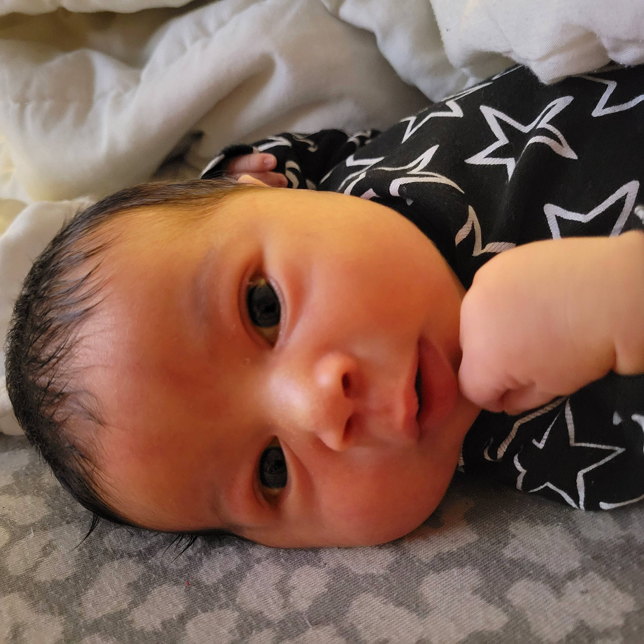 Joaquin is registered to the contest to win money with this photo: baby, baby_toddler_clothing, cheek, child, comfort, eyebrow, eyelash, face, grass, happy, linens, lip, no_expression, nose, pattern, person, portrait_photography, skin, sleeve, toddler