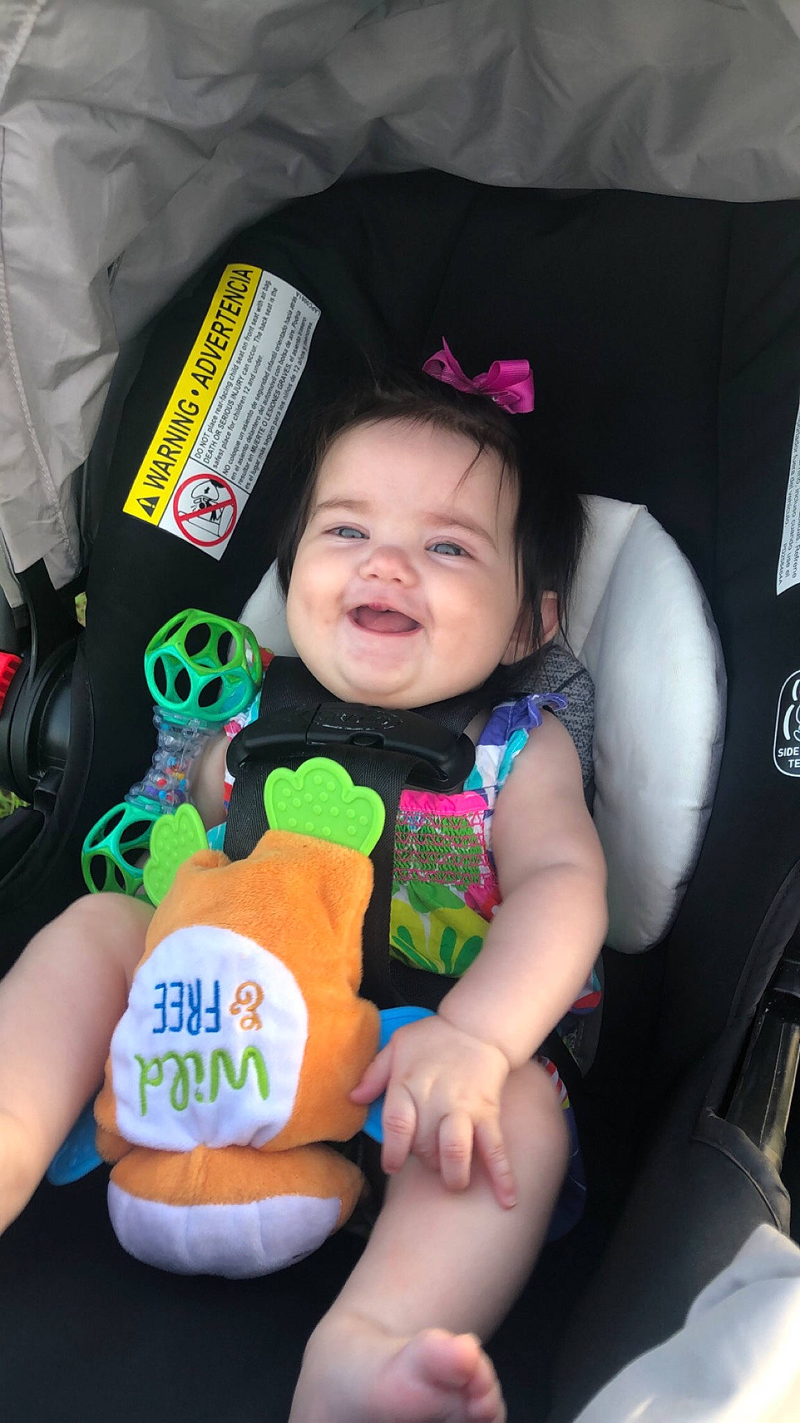 Annalise is registered to the contest to win money with this photo: baby, baby_carriage, baby_products, baby_toddler_clothing, car_seat, car_seat_cover, cheek, child, comfort, eye, finger, fun, hand, happy, joy, nail, person, sitting, skin, smile