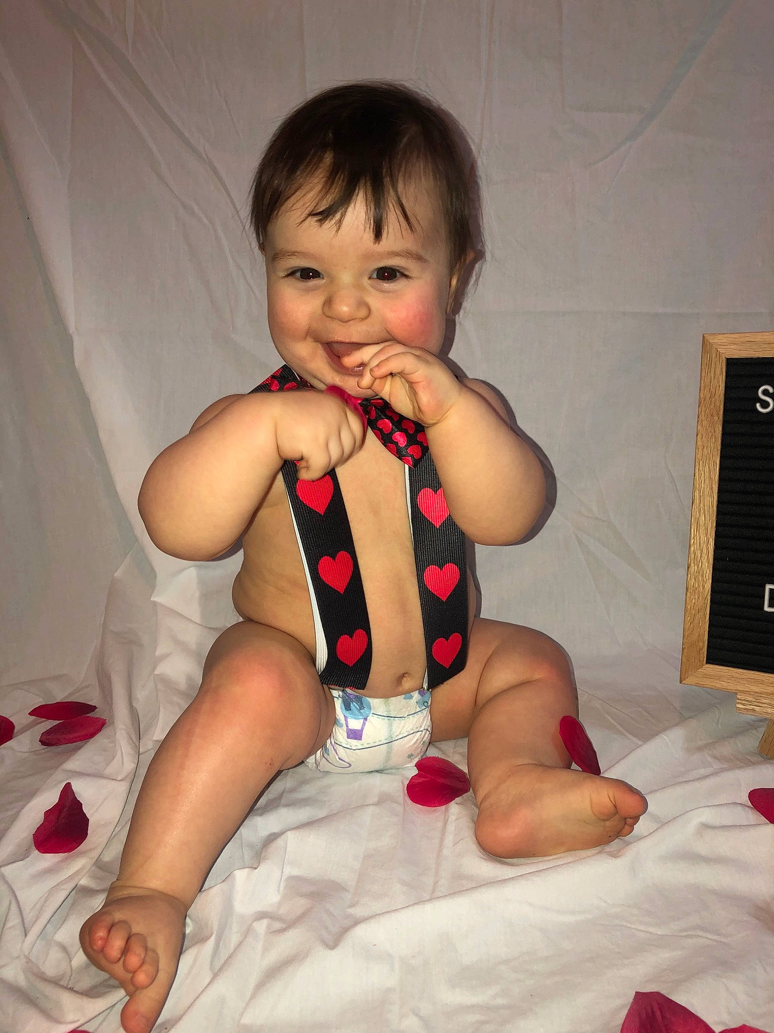 Clayton is registered to the contest to win money with this photo: arm, baby, baby_toddler_clothing, cheek, child, finger, joy, leg, mouth, nail, person, sitting, skin, thigh, thumb, toddler