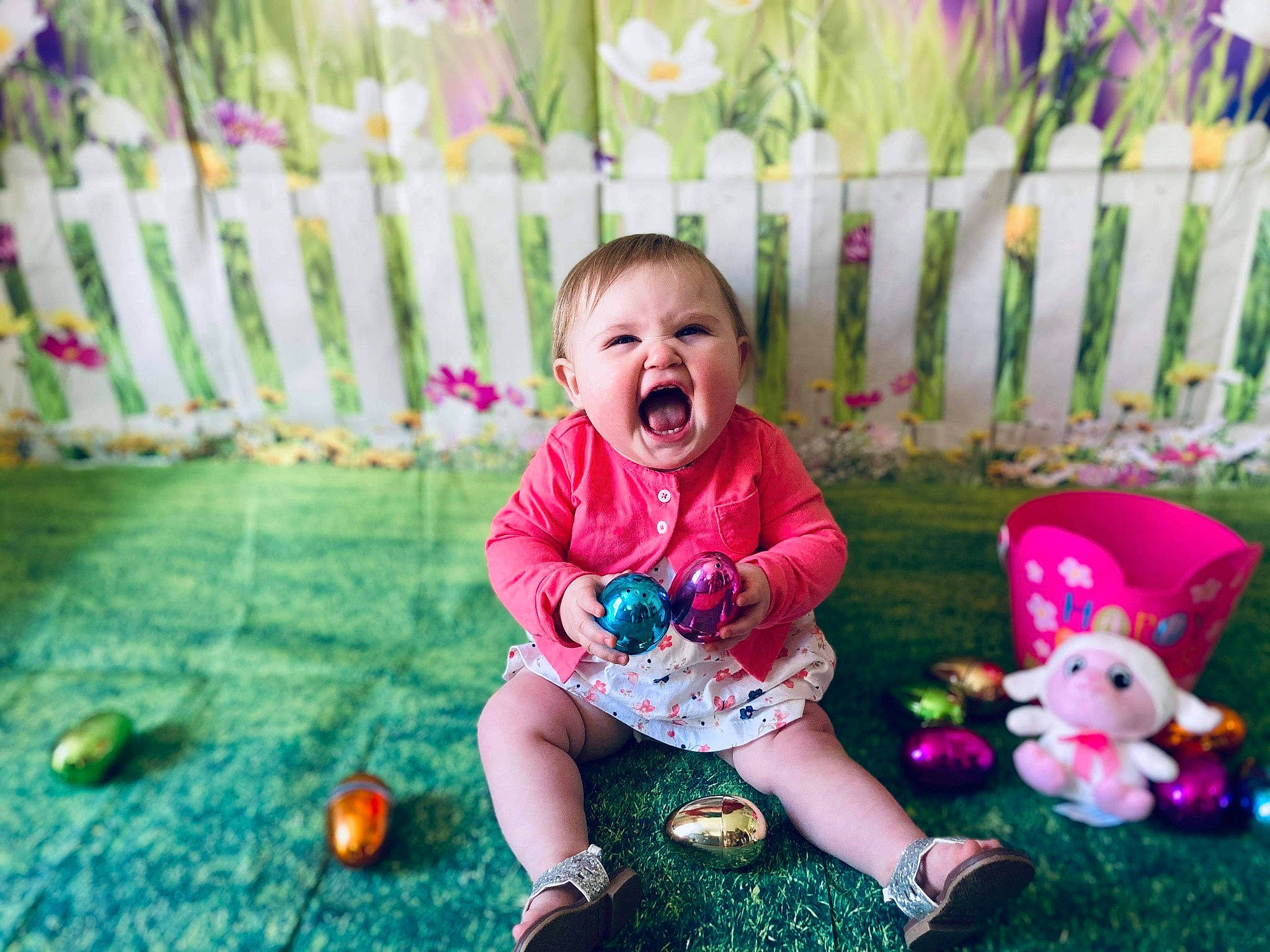 Amelia joined the competition — help win amazing prizes! baby, baby_toddler_clothing, child, dress, face, fence, fun, grass, green, happy, leisure, people, people_in_nature, person, pink, plant, playing_with_kids, recreation, smile, summer