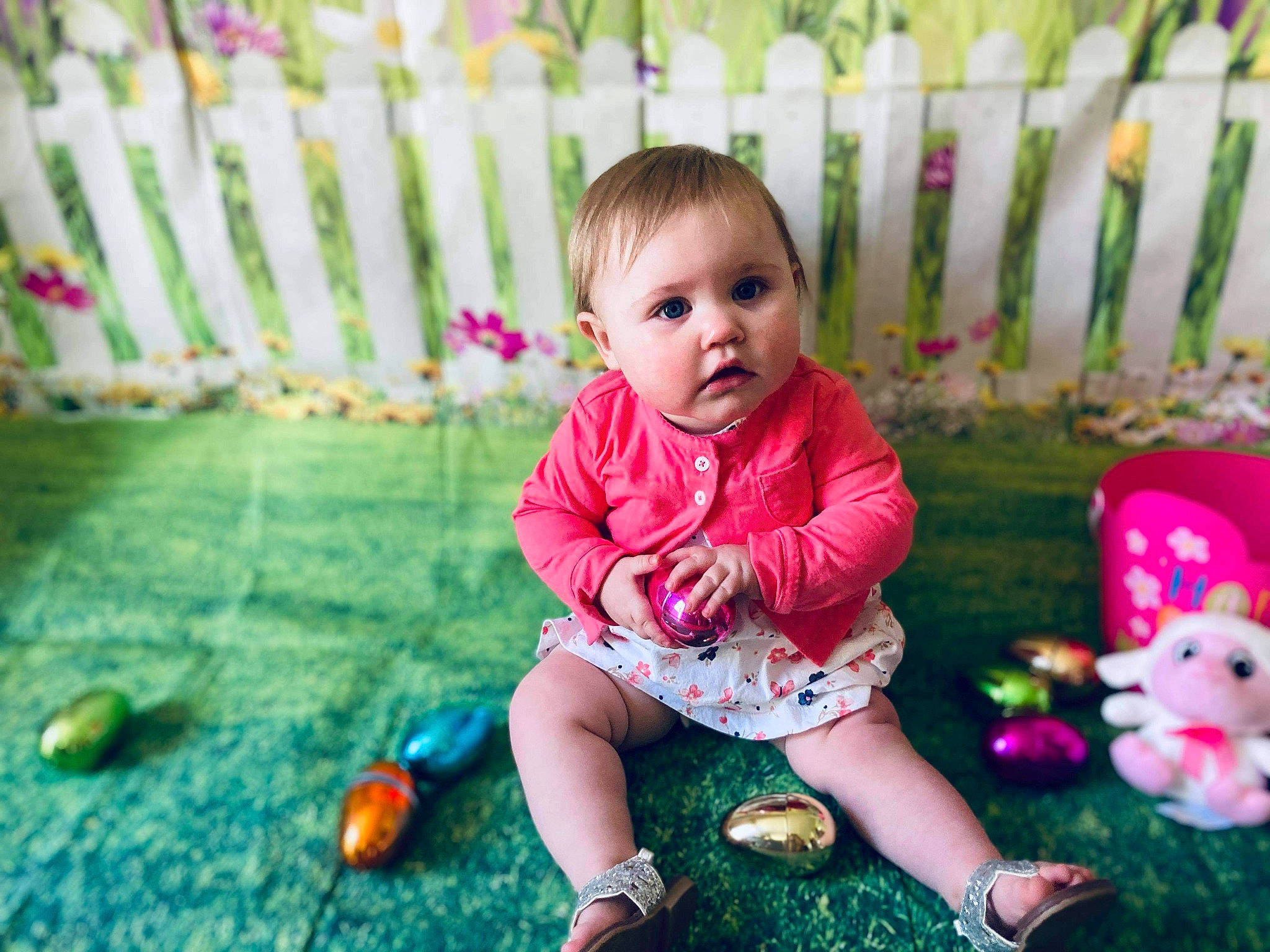 Amelia joined the competition — help win amazing prizes! baby, baby_toddler_clothing, clothing, eye, face, facial_expression, fence, grass, green, happy, head, leg, leisure, people_in_nature, person, pink, plant, shoe, skin, toddler