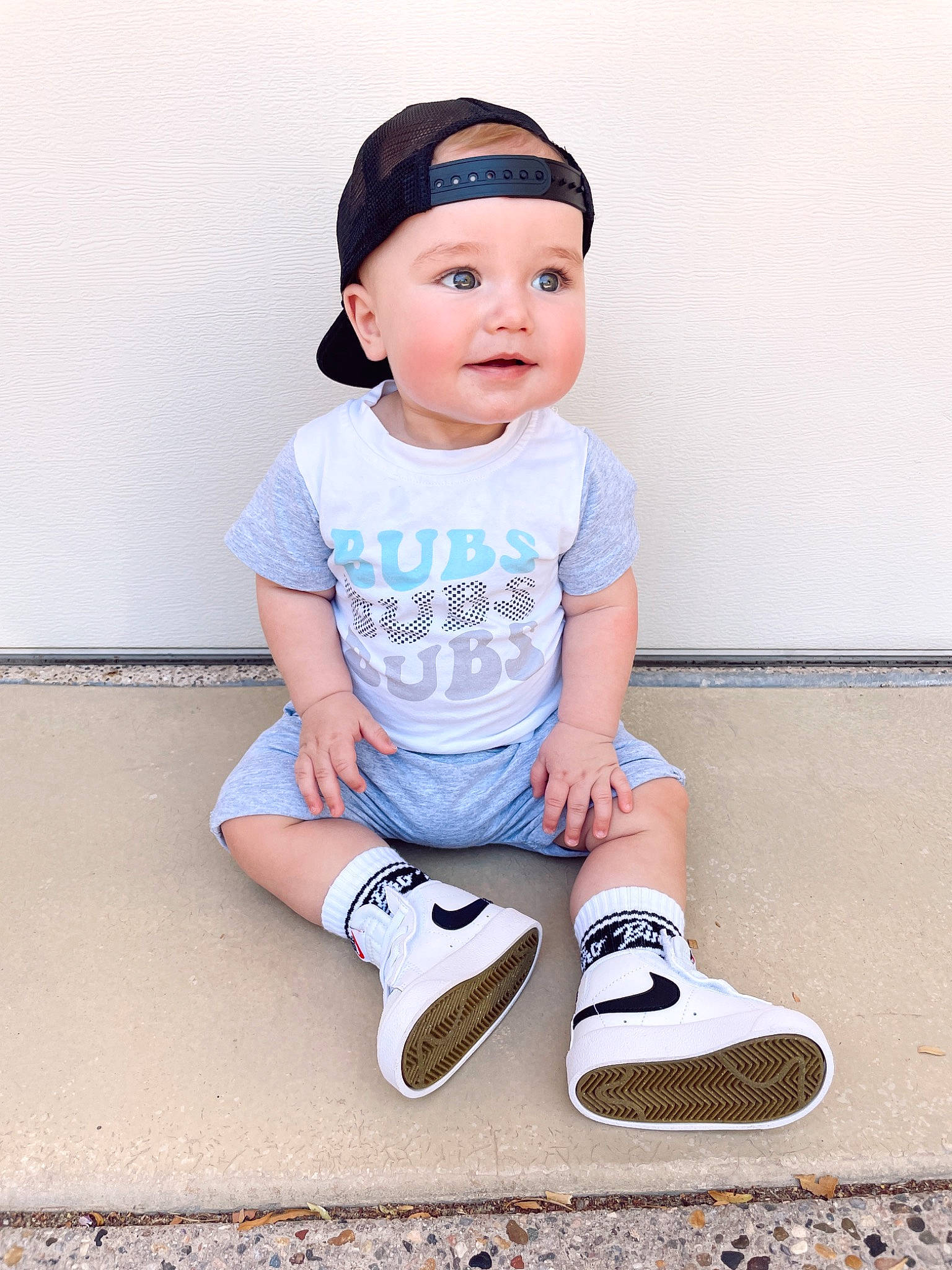 Jett is registered to the contest to win money with this photo: baby_toddler_clothing, cap, electric_blue, fashion_accessory, flash_photography, footwear, happy, headwear, human_leg, knee, outdoor_shoe, pattern, person, shoe, shorts, sleeve, sneakers, t_shirt, thigh, toddler