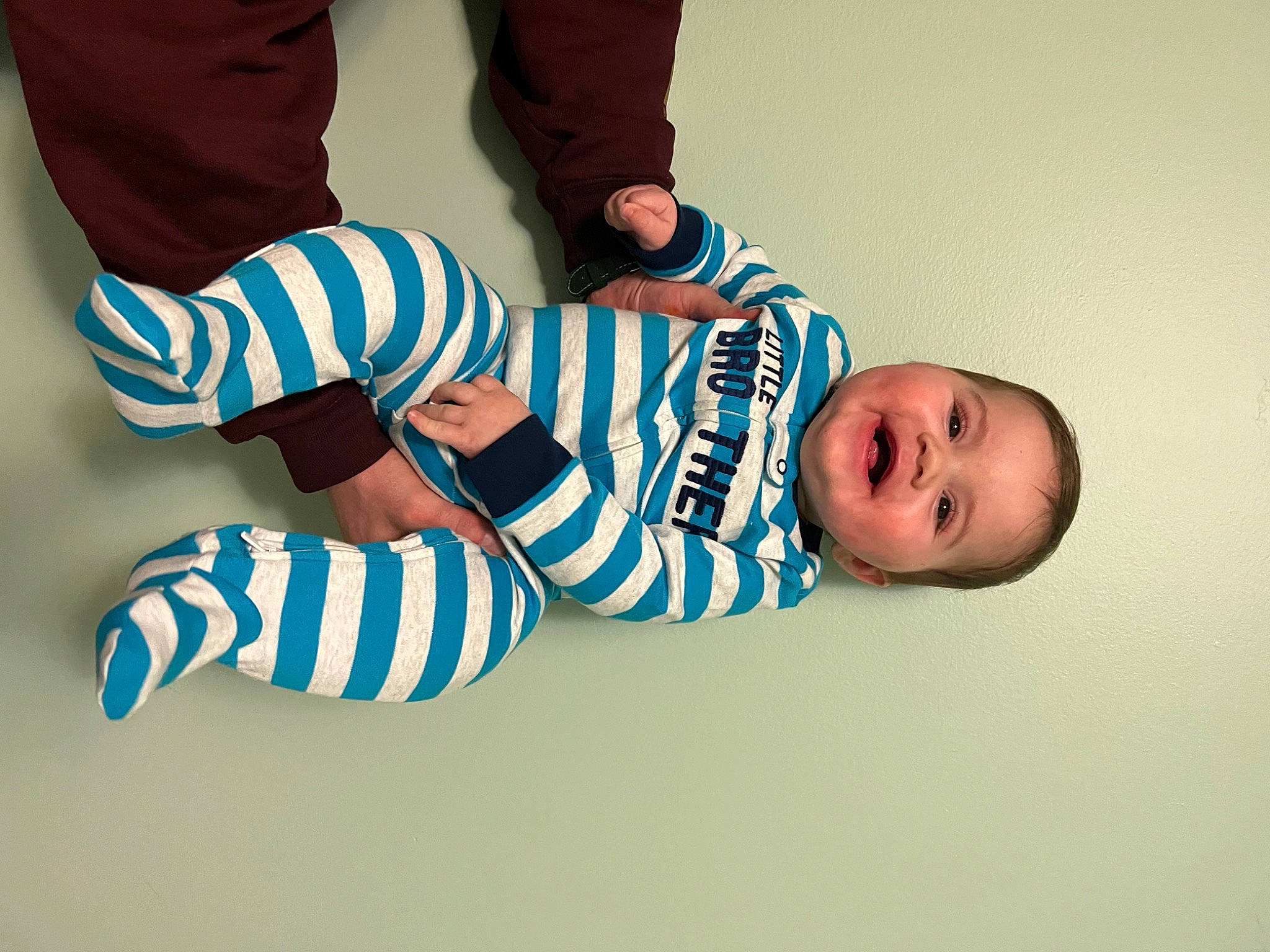Zayde is registered to the contest to win money with this photo: baby, baby_toddler_clothing, comfort, elbow, electric_blue, finger, flooring, font, foot, gesture, happy, human_leg, knee, person, sleeve, sock, sportswear, t_shirt, thigh, toddler