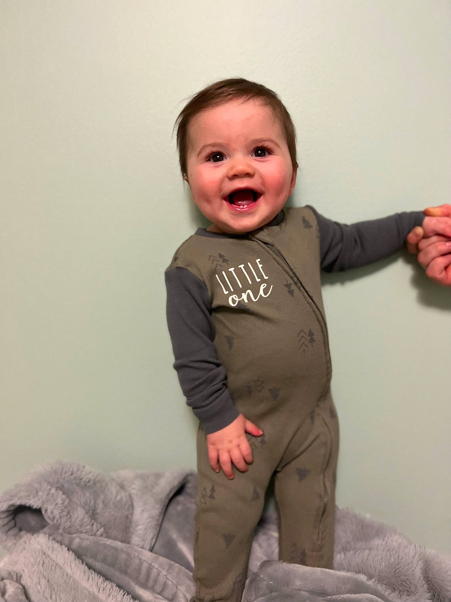 Zayde is registered to the contest to win money with this photo: baby_toddler_clothing, cheek, chin, collar, comfort, eye, finger, flash_photography, gesture, happy, head, human_body, neck, person, shoulder, skin, sleeve, smile, standing, stomach
