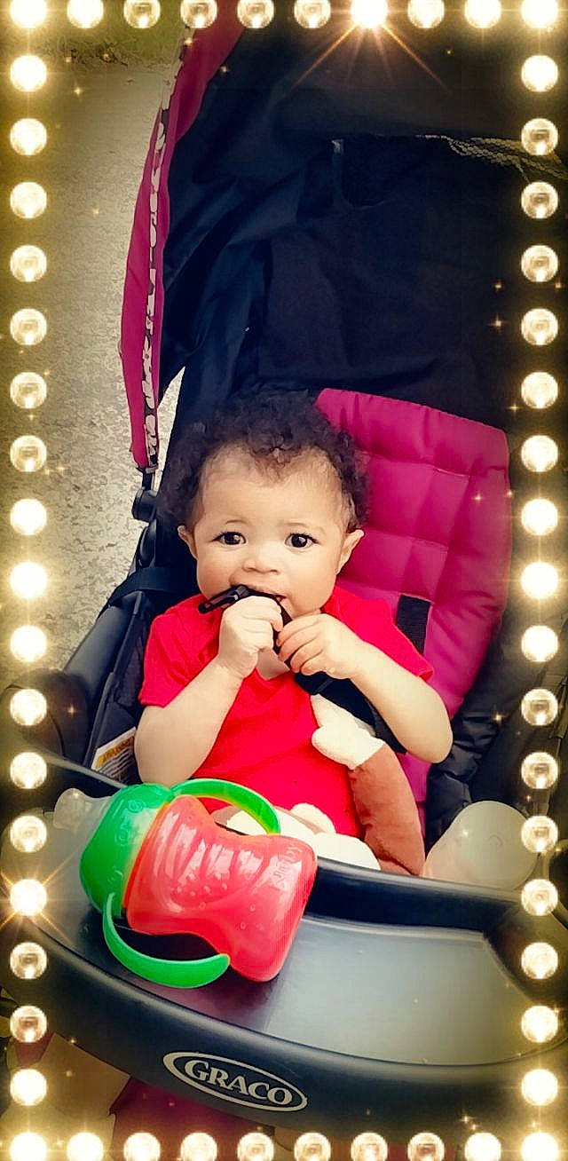 Kamiah joined the competition — help win amazing prizes! baby, baby_toddler_clothing, beauty, child, event, facial_expression, fun, happy, light, lighting, magenta, person, photograph, pink, product, red, sitting, skin, snapshot, toddler