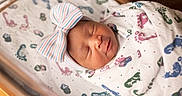 Mia joined the competition — help win amazing prizes! newborn, baby, sleeping, blanket, headband, bow, hospital, bassinet, footprint_pattern, wrapped, infant, peaceful, soft_lighting, cute, portrait, child, closeup, indoors, resting, sleep
