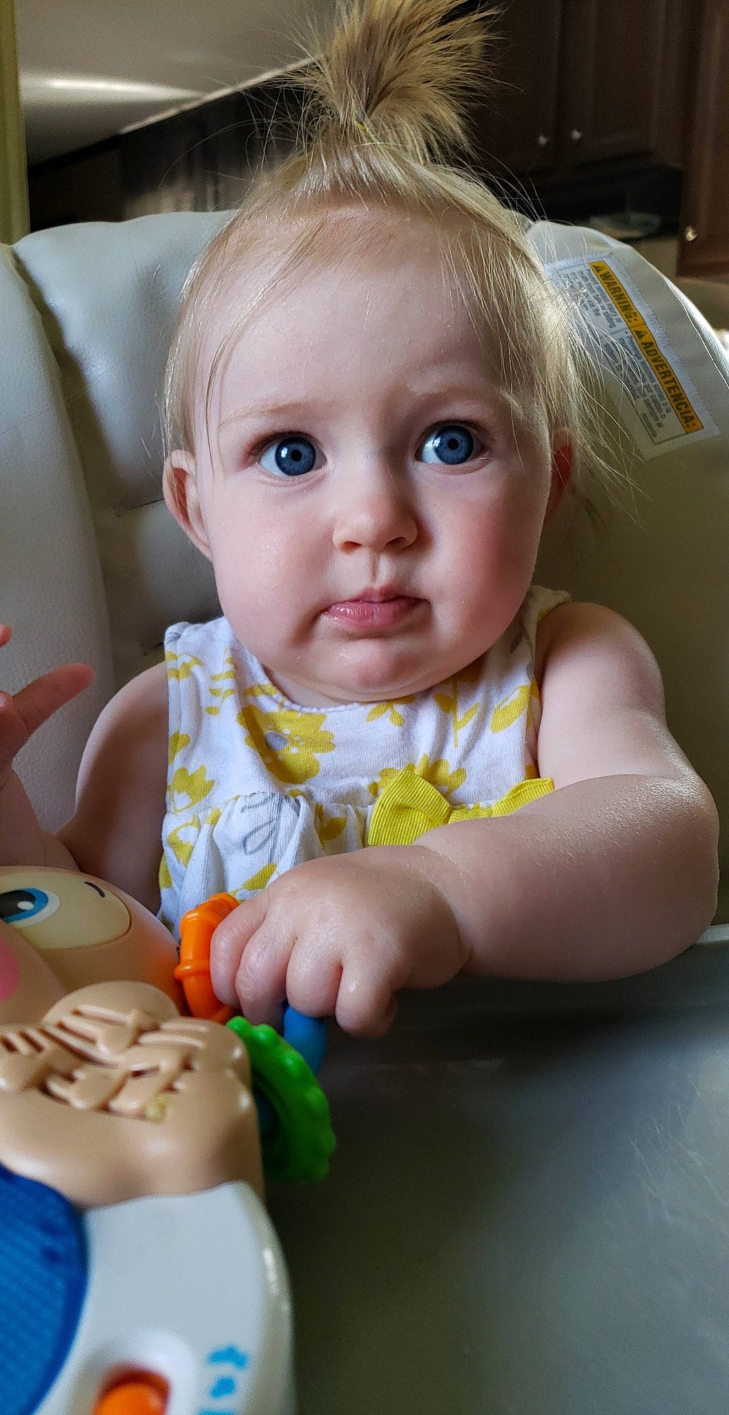 Jemma is registered to the contest to win money with this photo: baby, baby_food, baby_products, blond, cheek, child, eye, finger, iris, mouth, nose, person, play, skin, thumb, toddler, toy, tummy_time