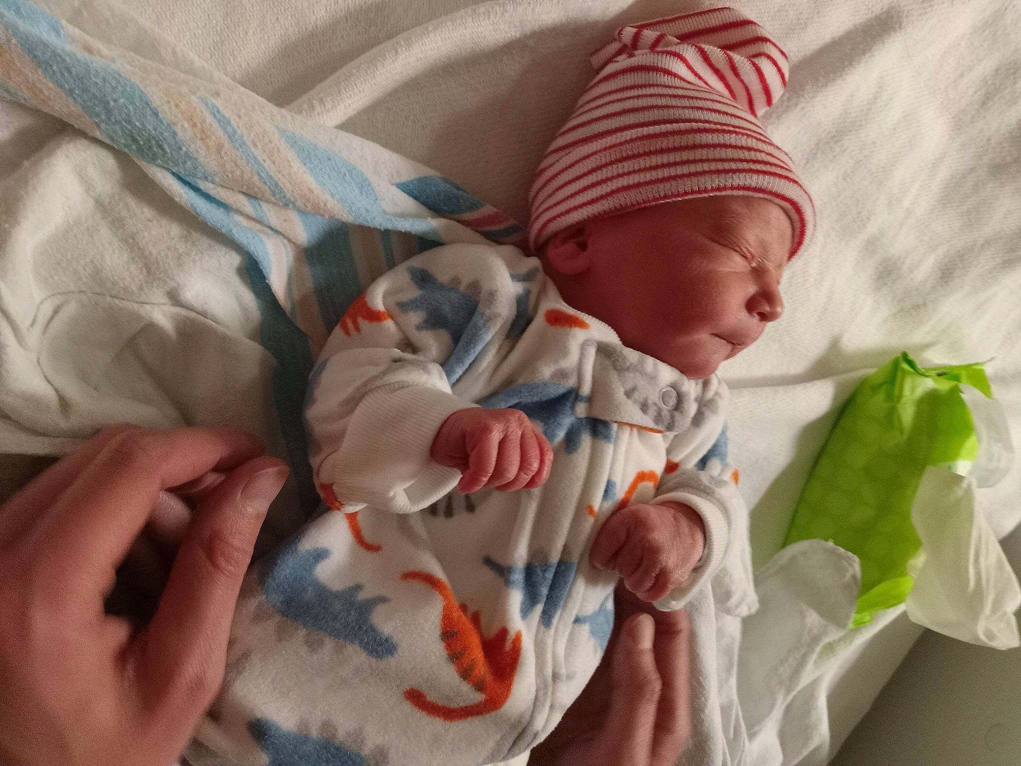 Atreyu is registered to the contest to win money with this photo: baby, baby_products, baby_safety, baby_sleeping, baby_toddler_clothing, bedding, bedtime, child, comfort, gesture, knit_cap, linens, nap, person, product, room, skin, sleeve, textile, thumb