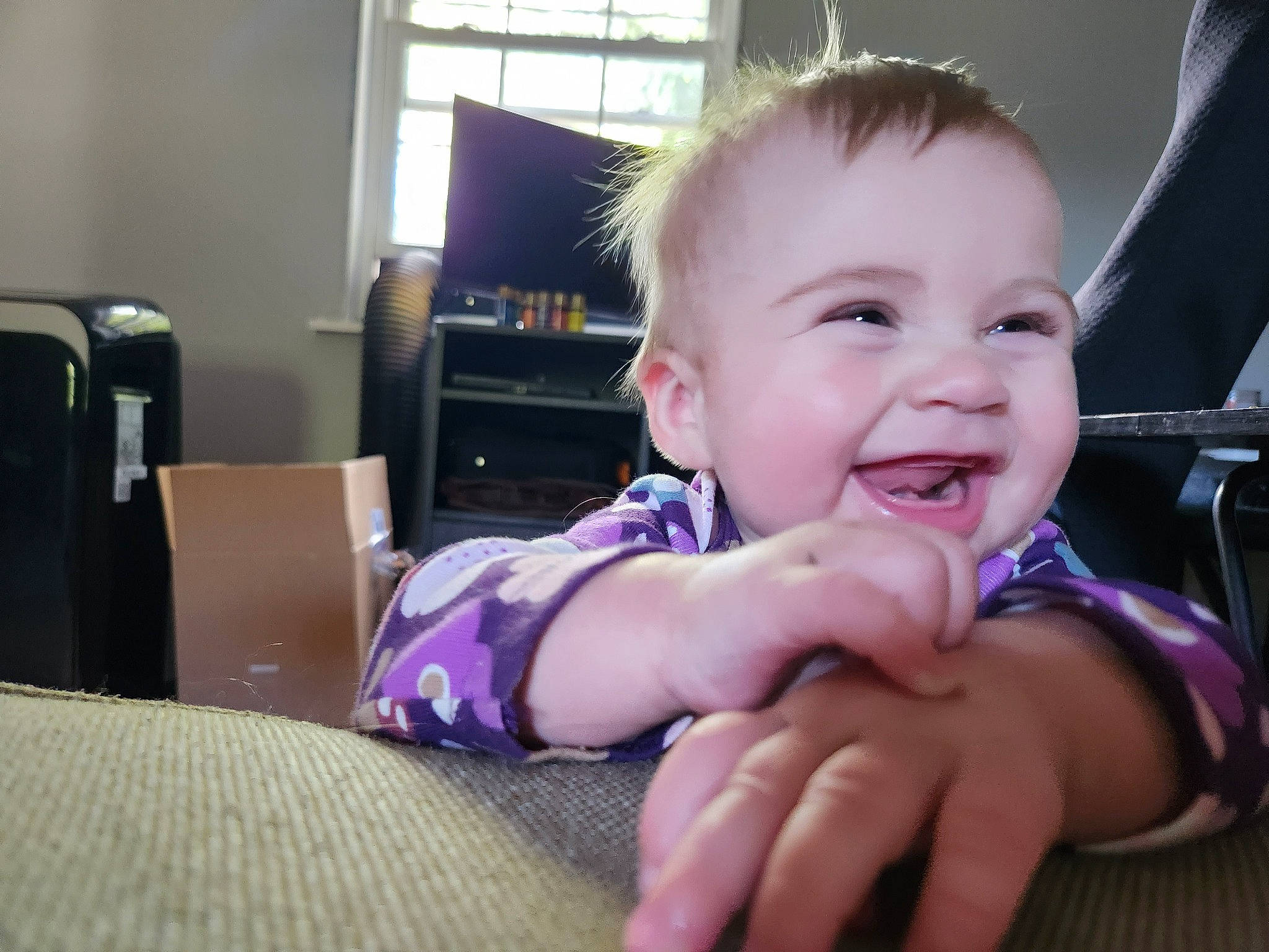 Ela is registered to the contest to win money with this photo: baby, baby_toddler_clothing, cheek, chin, comfort, ear, eyebrow, finger, fun, gesture, happy, iris, joy, mouth, nose, person, skin, smile, standing, thumb