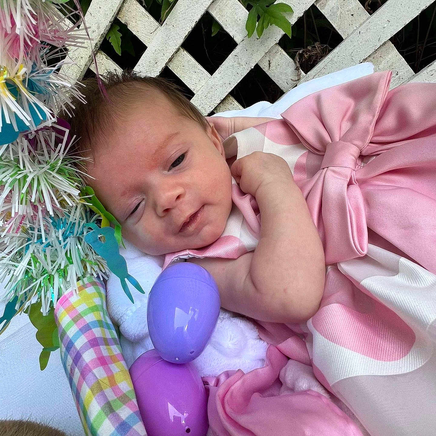 Autumn is registered to the contest to win money with this photo: baby, basket, bow, celebration, checkered_pattern, child, colorful, cute, decorations, easter_eggs, green_leaves, holiday, infant, outdoor, pink_dress, plastic_eggs, portrait, sleepy, soft_blanket, white_lattice