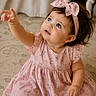 Nova joined the competition — help win amazing prizes! baby, child, girl, pink_dress, headband, bow, blue_eyes, curious, sitting, indoor, carpet, patterned_carpet, cute, portrait, infant, smiling, hand_reaching, soft_lighting, person, young_child