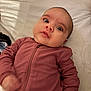 Cosette joined the competition — help win amazing prizes! baby, blanket, child, curious_expression, cute, eyes, face, head, human, indoors, infant, lying_down, person, pink_clothing, ribbed_fabric, skin, sleepwear, soft_texture, young, zipper