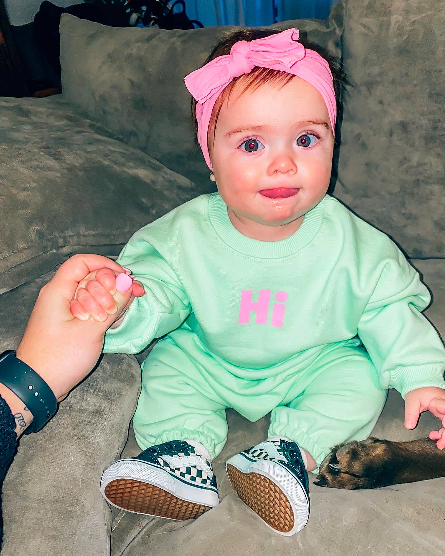 Holland is registered to the contest to win money with this photo: baby, baby_toddler_clothing, blue, cheek, child, cool, eye, happy, headwear, human_body, iris, lip, mouth, person, pink, skin, sleeve, sock, t_shirt, toddler