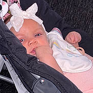 Star joined the competition — help win amazing prizes! baby, baby_carrier, babywearing, bib, black, bow, closeup, clothing, cute, fabric, face, hand, headband, indoor, infant, person, pink, portrait, sitting, young_child