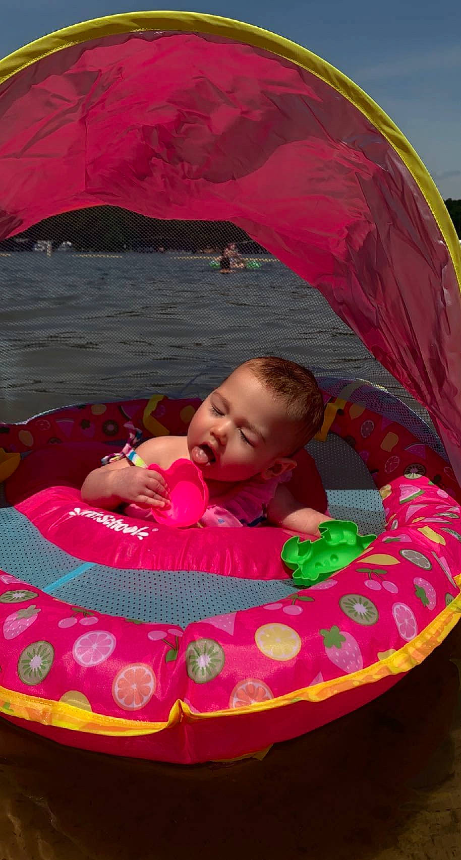 Paislee is registered to the contest to win money with this photo: baby, baby_float, baby_products, baby_toddler_clothing, bathing, child, comfort, event, fun, grass, inflatable, leisure, magenta, person, pink, play, product, recreation, red, toddler
