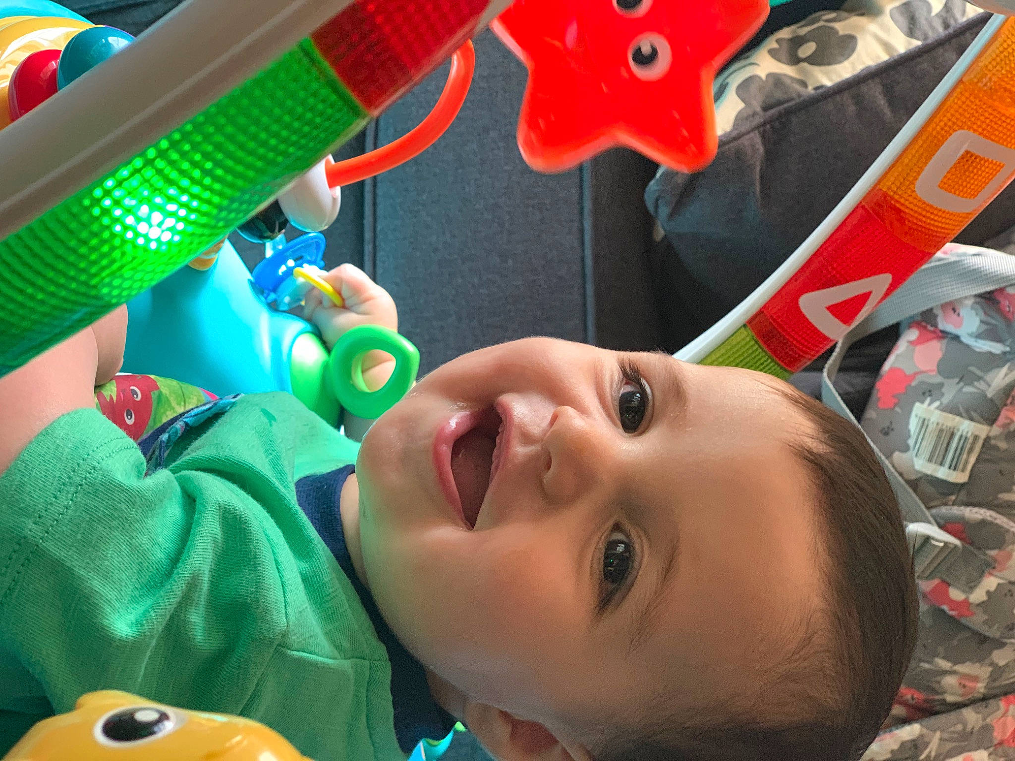 Azriel is registered to the contest to win money with this photo: baby, cheek, child, facial_expression, fun, green, happy, head, leisure, light, mouth, nose, people, person, photograph, product, red, smile, snapshot, toddler