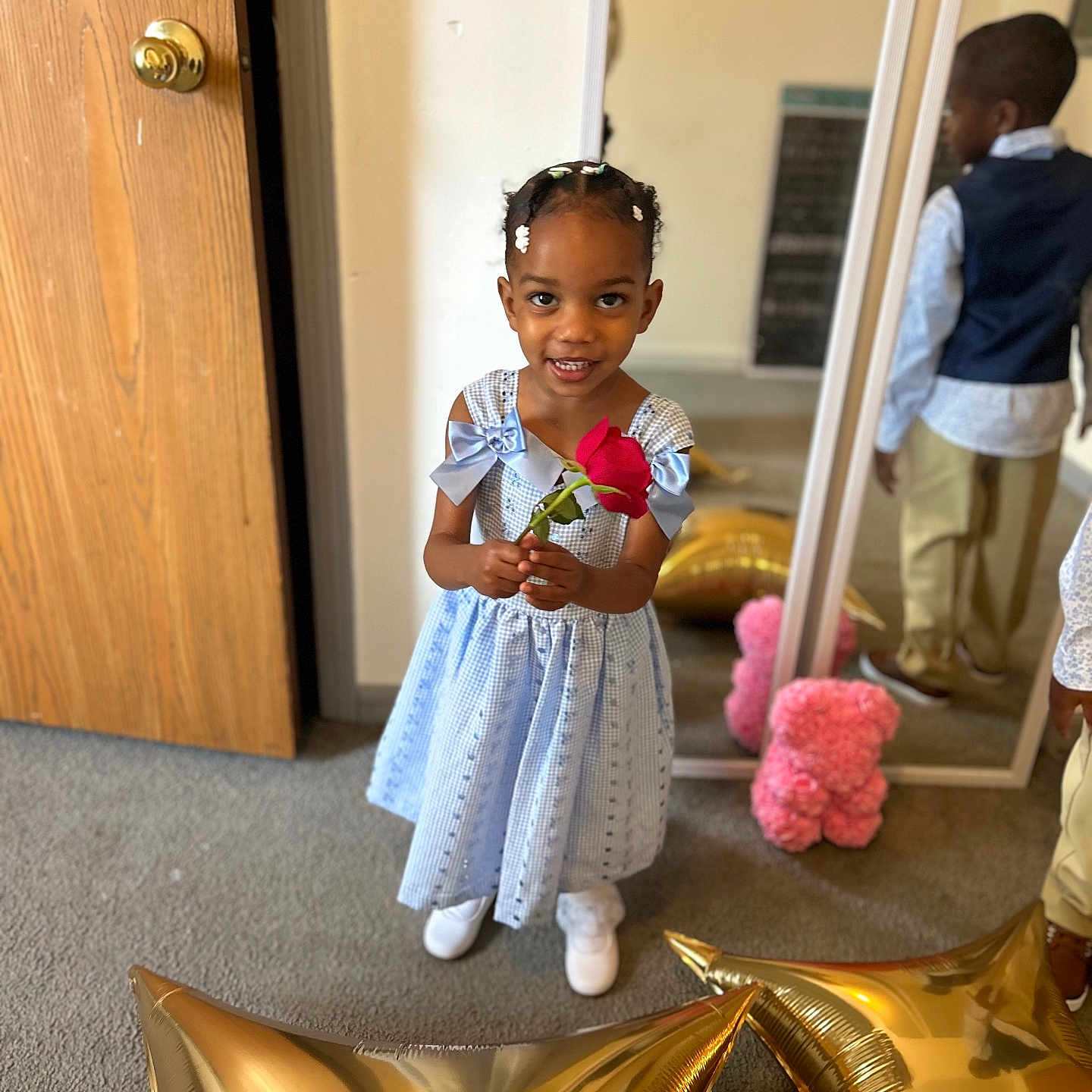 Jameria is registered to the contest to win money with this photo: boy, child, clothing, door, dress, face, female, flower, flowerarrangement, flowerbouquet, footwear, girl, head, male, person, photography, plant, portrait, pottedplant, shoe