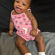 Zahria joined the competition — help win amazing prizes! baby, smiling, infant, pink_romper, white_socks, lying_down, happy, cute, child, skin, face, hand, leg, black_background, gray_blanket, portrait, indoors, one_person, apparel, people