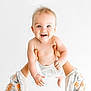 Tobias joined the competition — help win amazing prizes! baby, child, smiling, happy, blue_eyes, skin, arms, hands, white_background, infant, cute, playful, person, clothing, floral_pattern, holding, portrait, indoors, young, cheerful