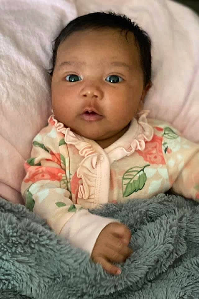 Kamilah joined the competition — help win amazing prizes! baby, baby_toddler_clothing, cheek, comfort, eye, face, facial_expression, finger, head, iris, lip, mammal, mouth, nose, organ, outerwear, person, skin, sleeve, textile