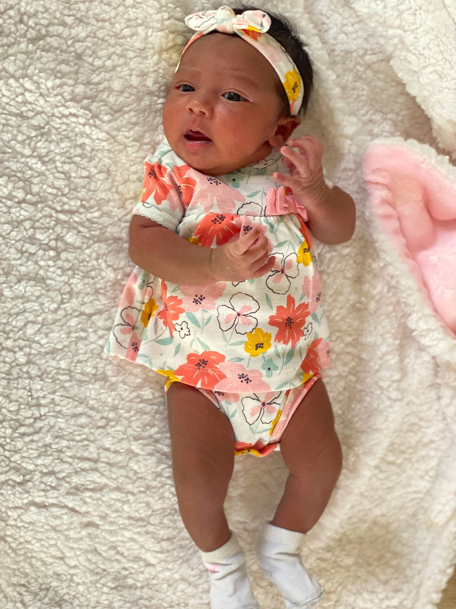 Kamilah is registered to the contest to win money with this photo: baby, baby_toddler_clothing, child, dress, eye, face, finger, hand, happy, head, headwear, human_body, iris, lip, pattern, person, pink, skin, sleeve, thigh