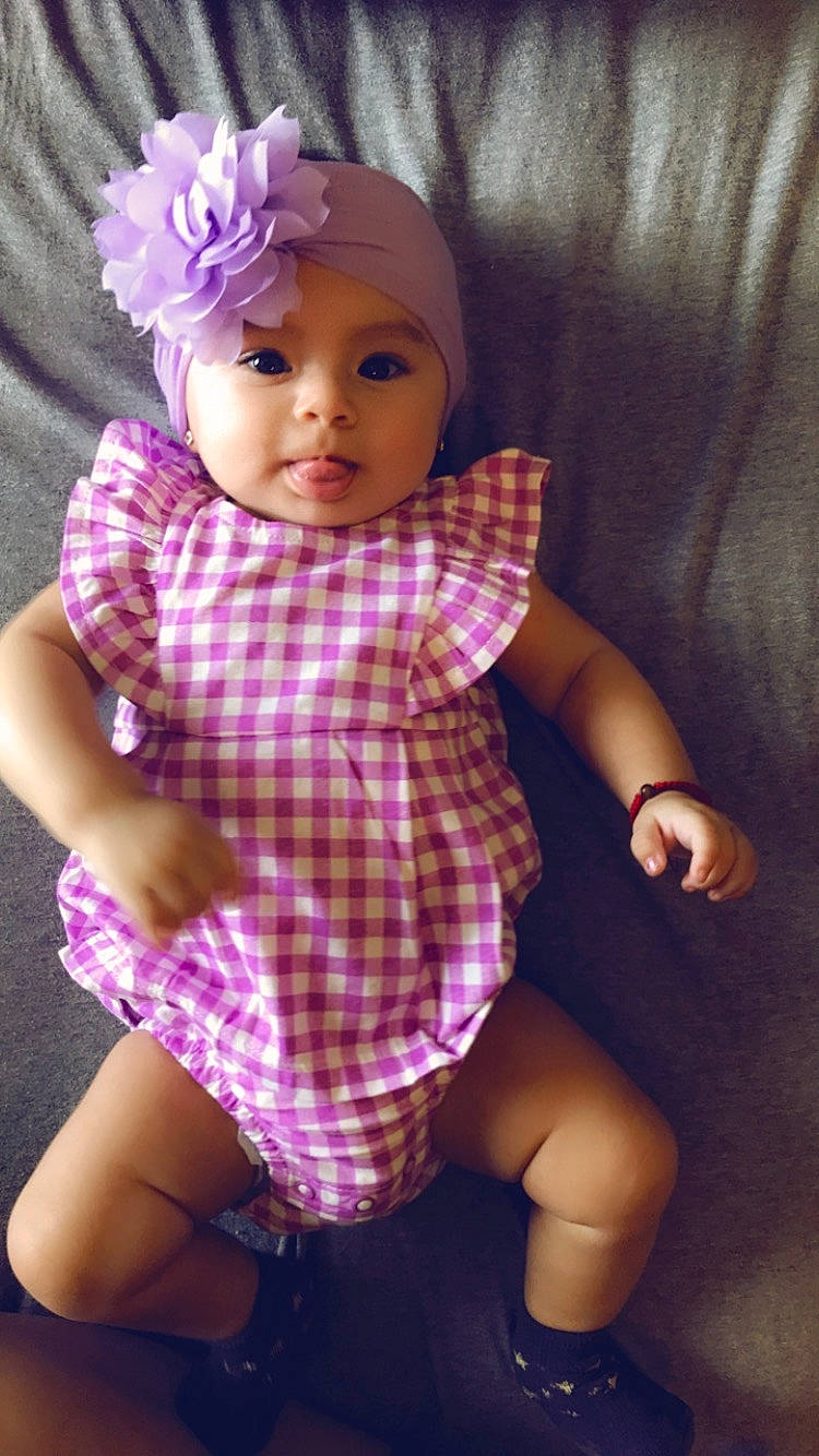 Daleyza is registered to the contest to win money with this photo: baby, baby_toddler_clothing, cheek, child, doll, head, headgear, headwear, person, pink, purple, skin, toddler, toy