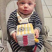 Kenzo a rejoint le concours — aidez-le/la à gagner de superbes lots ! baby, baby_seat, bib, blue_eyes, child, cushion, cute, floor_tiles, holding_toy, home, indoor, infant, looking_at_camera, playtime, portrait, seated, socks, soft_toy, striped_clothing, young_child