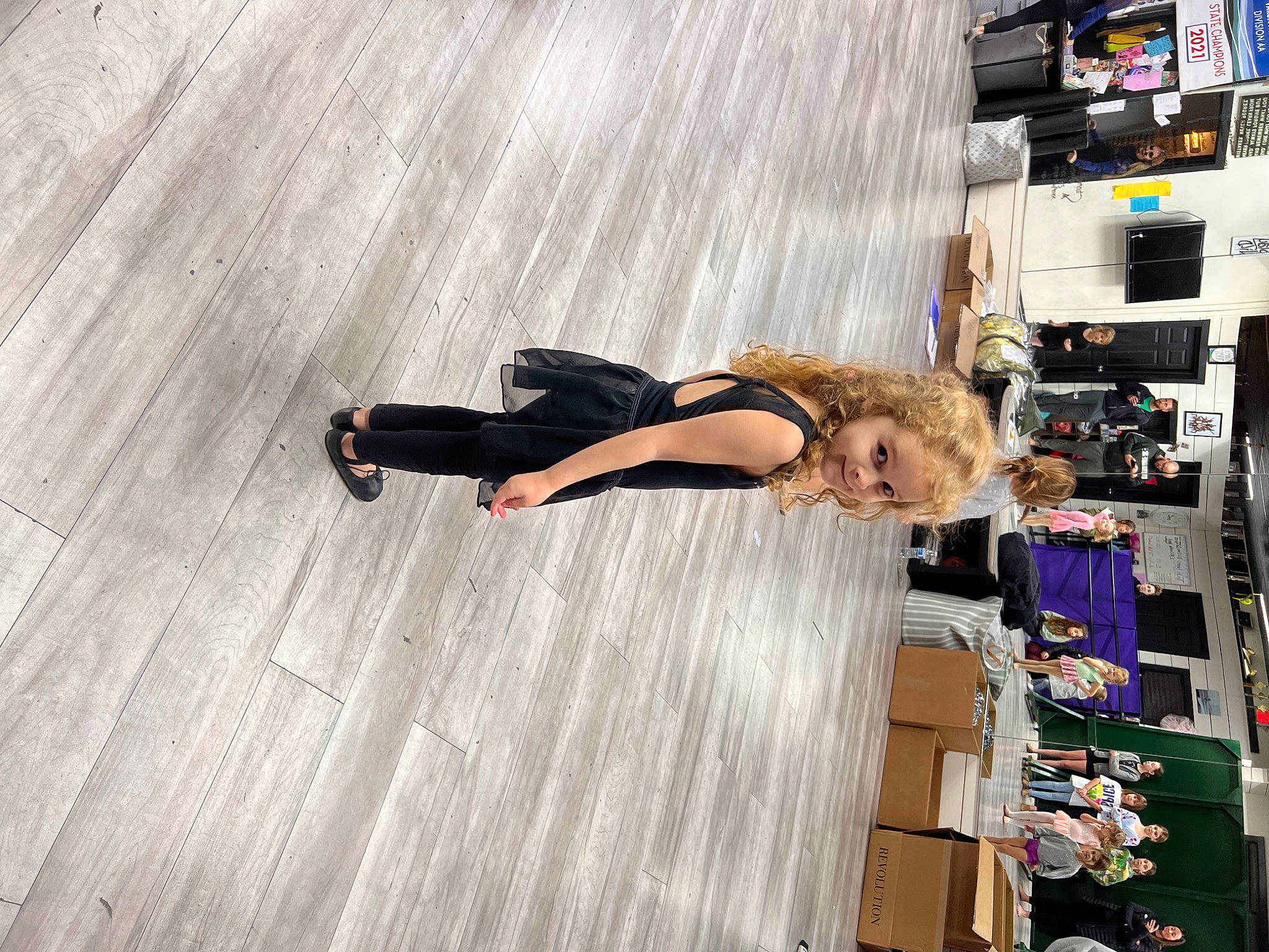 Rory is registered to the contest to win money with this photo: eyewear, flooring, fun, hardwood, human_leg, knee, laminate_flooring, leisure, machine, person, recreation, room, thigh, wood, wood_flooring