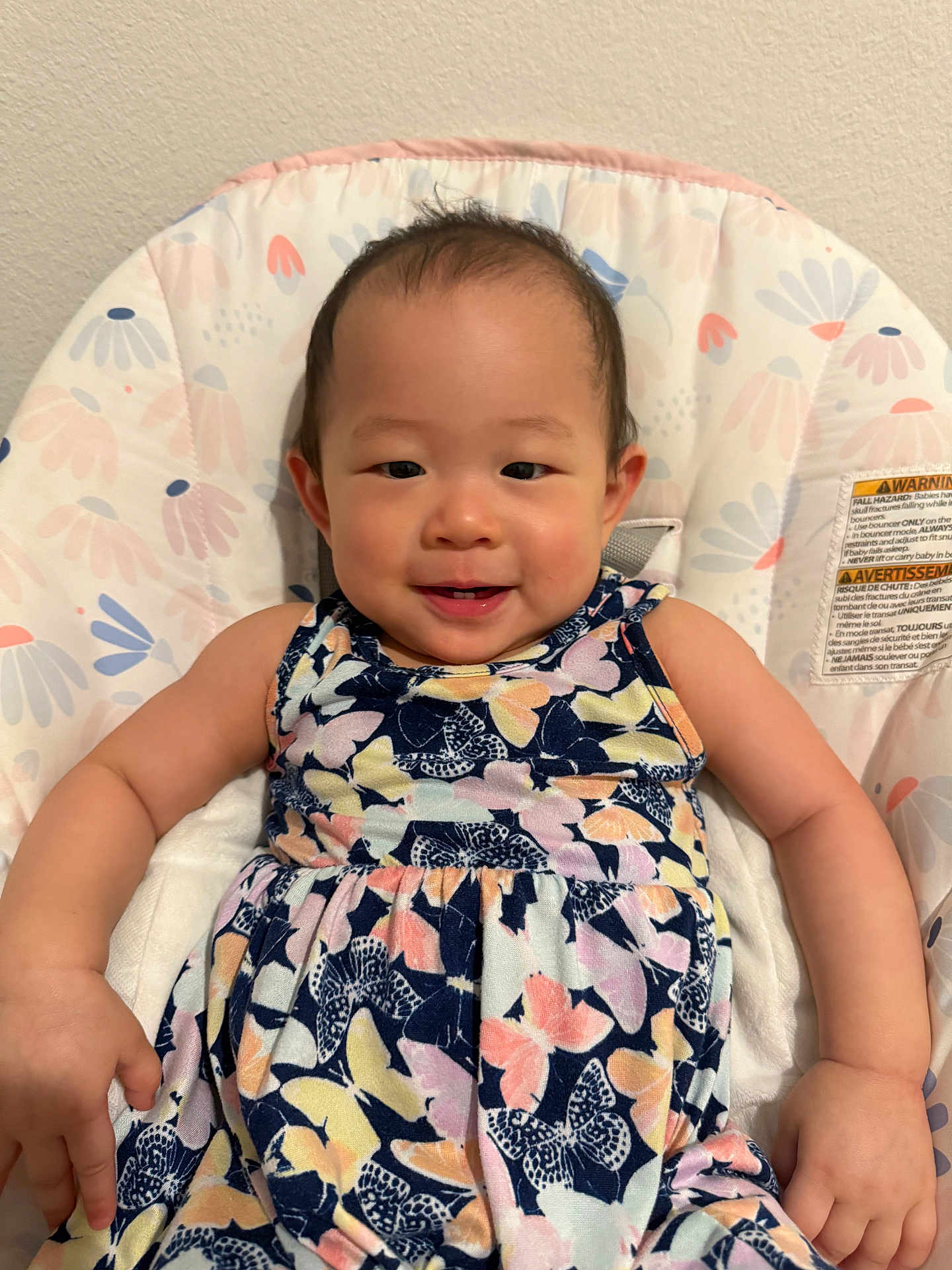 Hailyn is registered to the contest to win money with this photo: baby, child, smiling, dress, butterfly_pattern, cushion, seat, indoor, wall, happy, infant, person, cute, skin, hair, arm, hand, face, eyes, photography