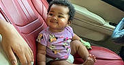Sanai joined the competition — help win amazing prizes! baby, child, car_interior, red_leather_seat, onesie, cartoon_characters, smiling, hand, seat, window, door, dashboard, steering_wheel, cable, technology, comfort, cute, infant, happy, portrait