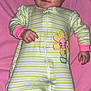 Aurora is registered to the contest to win money with this photo: baby, infant, onesie, striped_clothing, flower_patch, pink_blanket, lying_down, red_eye, portrait, child, cute, soft_texture, hand, face, sleepwear, newborn, person, indoors, skin, expression