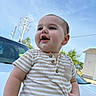 baby, child, infant, portrait, smiling, happy, outdoor, daylight, sky, blue_sky, striped_clothing, onesie, short_sleeves, car, parked_car, power_lines, residential_area, closeup, standing, face