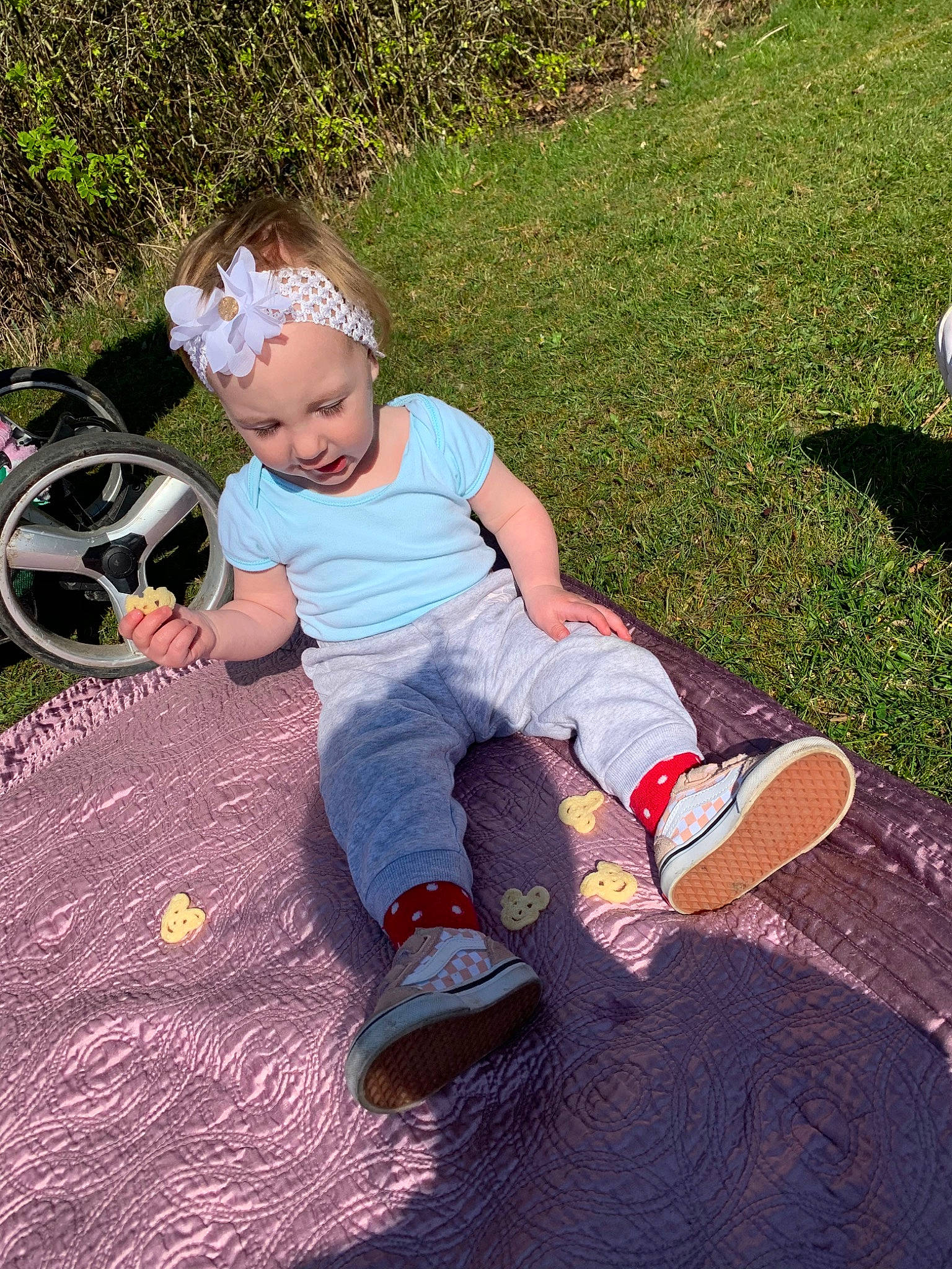 Hanna is registered to the contest to win money with this photo: backyard, child, cool, fun, grass, happy, headwear, lawn, leg, leisure, person, plant, play, playground, public_space, recreation, sitting, toddler, tree, vacation