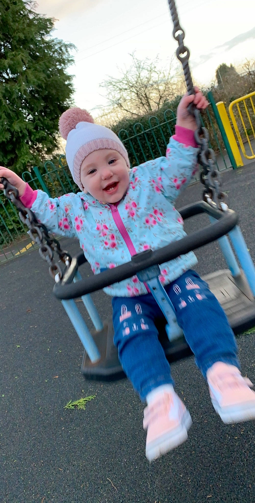 Hanna is registered to the contest to win money with this photo: child, headwear, joy, outdoor_play_equipment, person, play, playground, public_space, recreation, smile, swing, toddler
