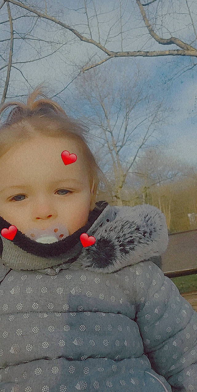 Kelya participe au concours pour gagner de l'argent avec cette photo : cap, cheek, eyelash, freezing, frost, fur, grass, happy, lip, nose, outerwear, pattern, person, precipitation, sky, snow, street_fashion, tree, twig, winter