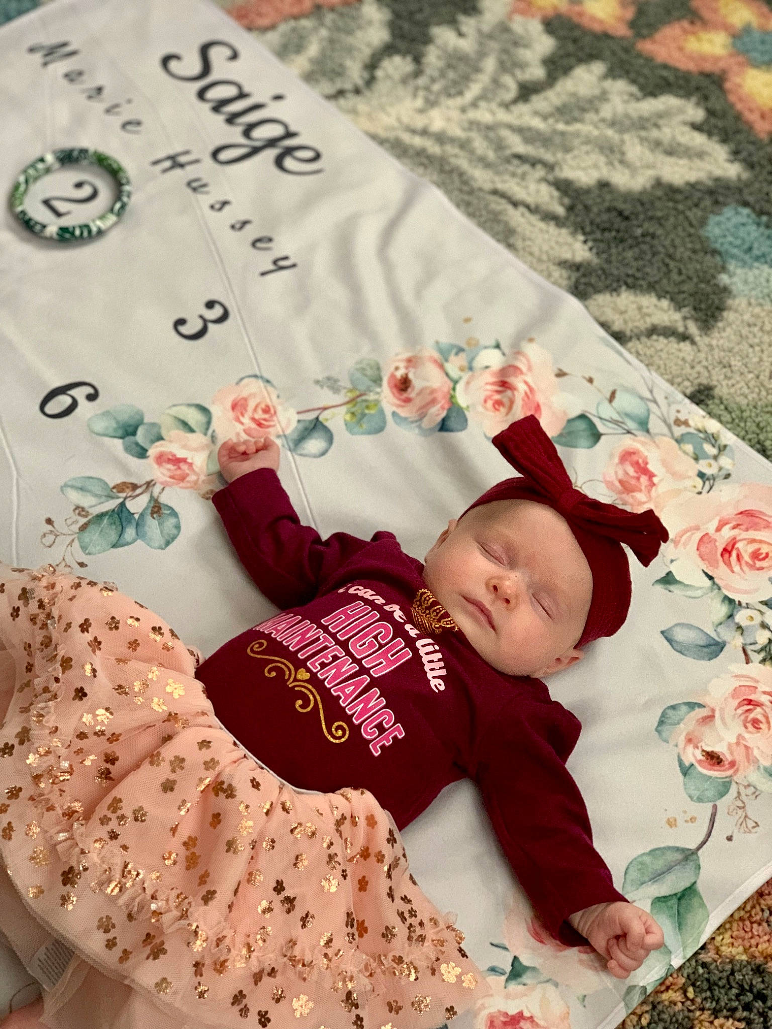 Saige is registered to the contest to win money with this photo: baby, baby_sleeping, baby_toddler_clothing, bedding, child, clothing, comfort, font, happy, headwear, linens, magenta, pattern, person, pink, product, skin, sleeve, t_shirt, textile