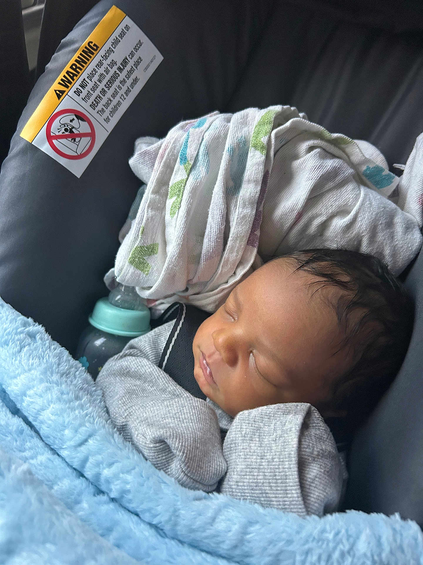 Duraey is registered to the contest to win money with this photo: baby, newborn, sleeping, car_seat, blanket, mittens, bottle, cloth, infant, child, face, portrait, rest, cozy, indoor, cute, peaceful, babycare, soft, toddler
