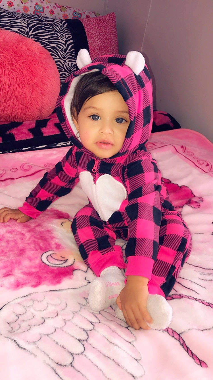 Allyson is registered to the contest to win money with this photo: baby, baby_toddler_clothing, beauty, cheek, child, costume, ear, eye, fur, happy, head, headgear, pattern, person, pink, skin, stuffed_toy, textile, toddler