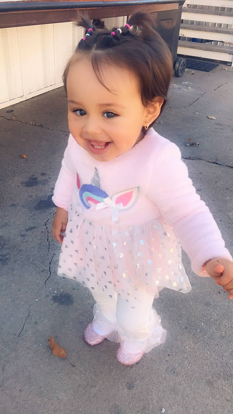 Allyson is registered to the contest to win money with this photo: baby, baby_toddler_clothing, cheek, child, joy, outerwear, person, pink, skin, sleeve, toddler