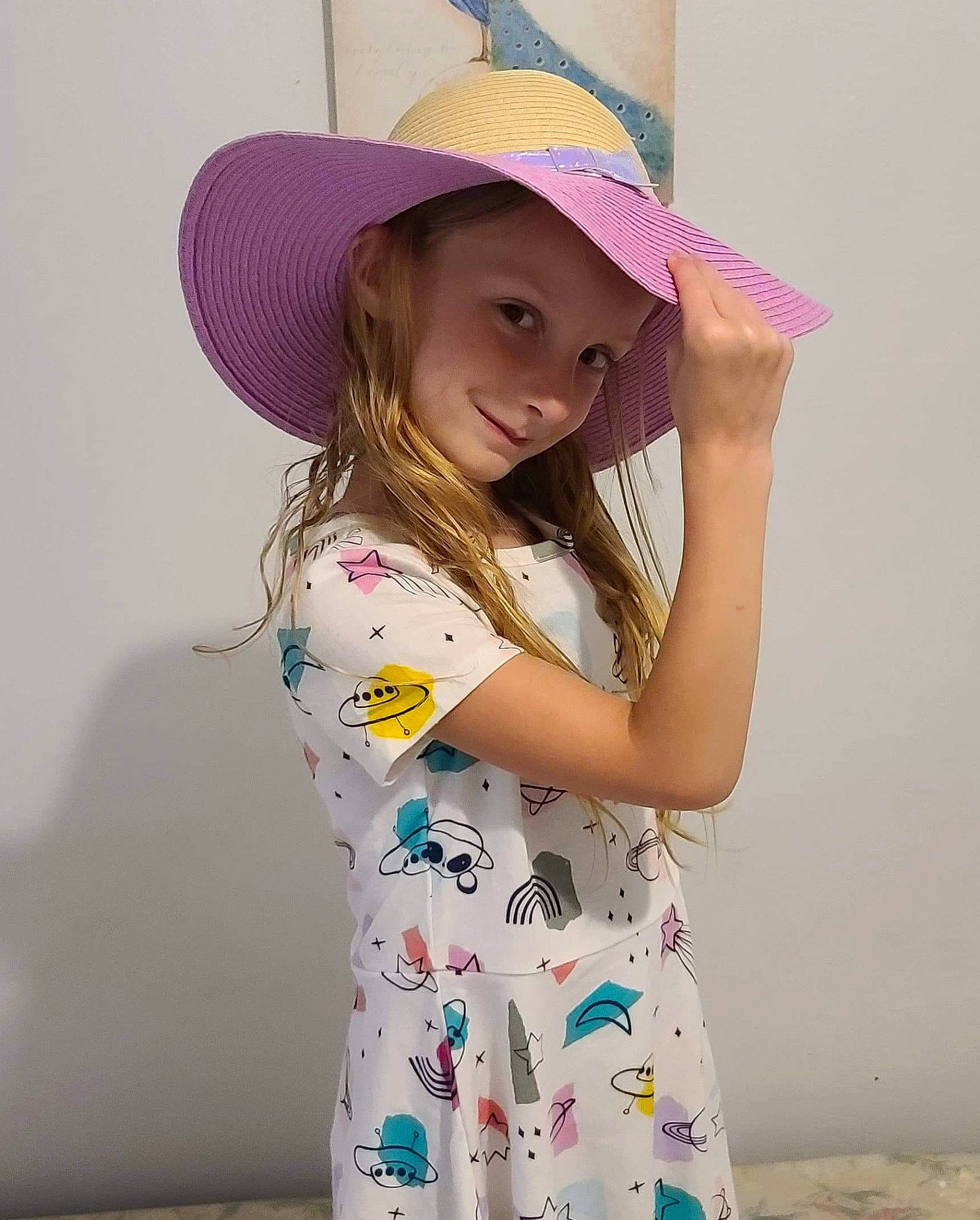 Hope is registered to the contest to win money with this photo: child, clothing, costume_accessory, costume_hat, fashion_accessory, hat, headgear, headwear, joy, pattern, person, pink, purple, sun_hat, toddler