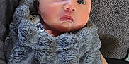 Colton is registered to the contest to win money with this photo: baby, blanket, closeup, cozy, cradled, eyes, face, fluffy, gray, hand, indoors, infant, newborn, person, portrait, skin, soft, texture, wrapped, young