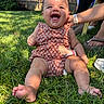 baby, grass, outdoor, laughter, joy, child, summer, greenery, sunlight, smile, person, cute, infant, hand, support, nature, happy, casual, patterned_clothing, barefoot