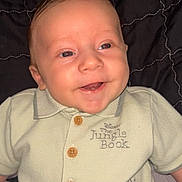 Jordan joined the competition — help win amazing prizes! baby, smiling, infant, clothing, shirt, jungle_book, blanket, quilted, happy, cute, child, portrait, lying_down, indoors, face, head, buttoned_shirt, toddler, young_child, soft_lighting
